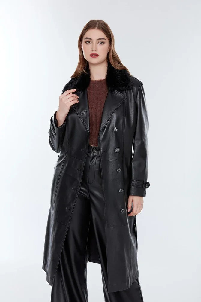 Woman wearing long black distressed leather jacket with faux fur collar