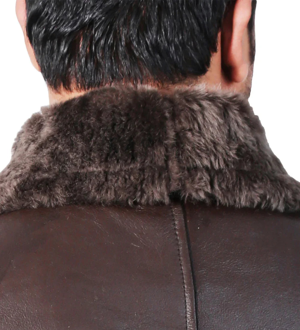 Close-up of brown distressed leather jacket with dark shearling collar, back view